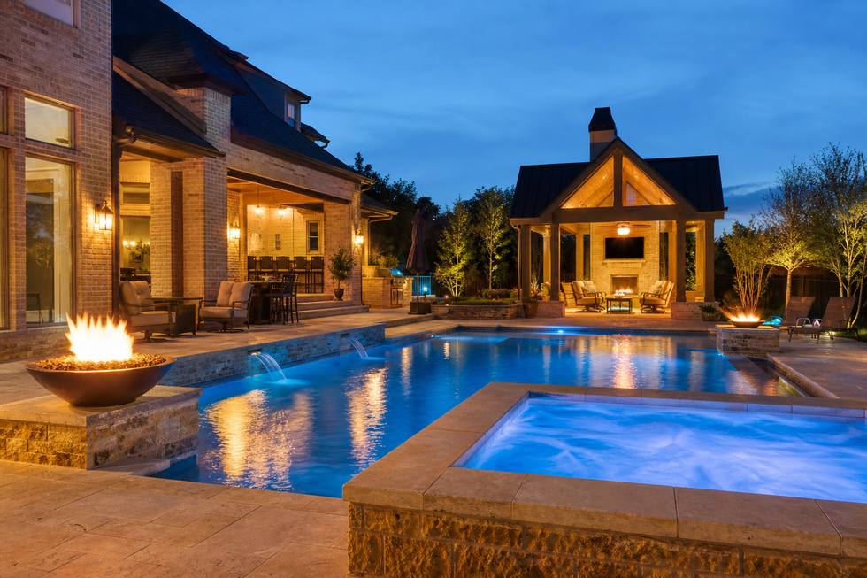 Colleyville luxury backyard pool with spa and fire bowls