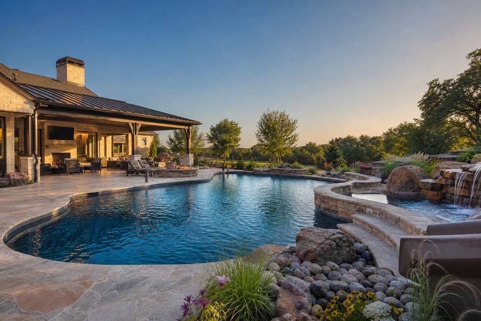 Flower Mound resort pool with natural stone accents