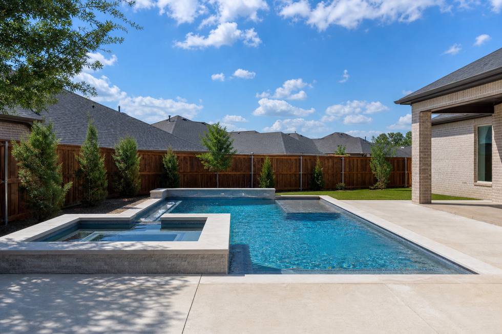 Saginaw family pool with spa and clean decking